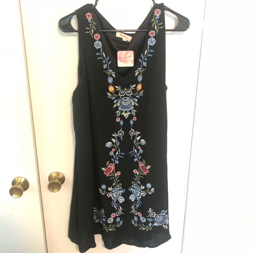 Beautiful black top with the tags on